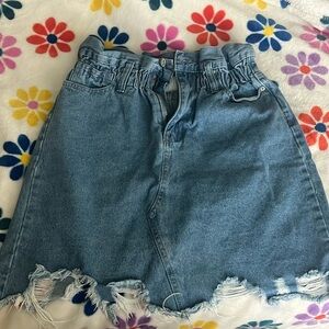 Ripped blue jean mini skirt